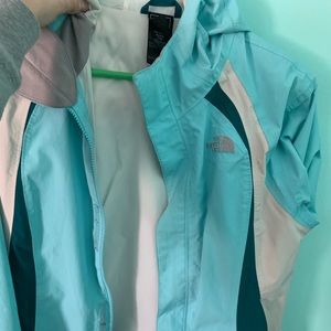 a light blue north face coat
